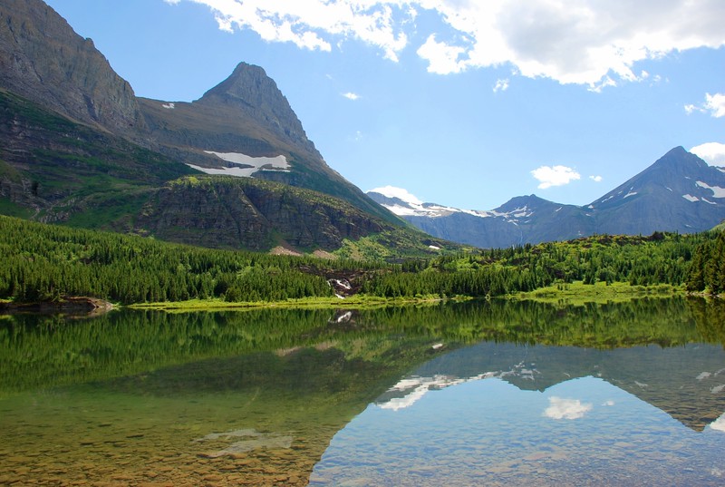 Fishercap Lake with reflection mountains in Glacier National Park.
