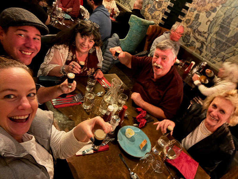 Group of travelers in a pub