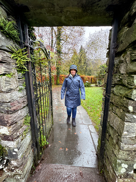 Lina Stock walking in a garden in Grasmere, England